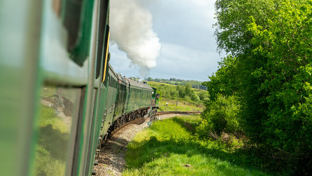 Swanage steam railway with steam train coming into station in Dorset
