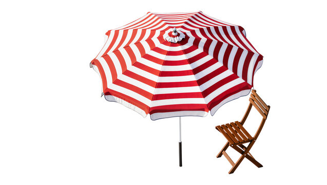 Isolated festive red and white striped beach umbrella alongside a classic wooden folding chair