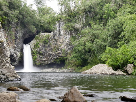 Bassin la Mer, scenic waterfall and natural pool in lush jungle in Reunion island, near Saint Benoit.