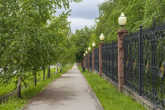 4 May 202 Path in the park with a fence and lanterns, First President's Park in Almaty,  Almaty City, Kazakhstan