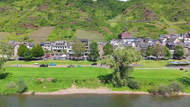 Explore Mosel, Germany with views of the town and river on a sunny day