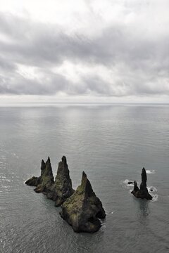 Reynisdrangar basalt sea stacks in the ocean, Vik, Iceland, Atlantic Ocean