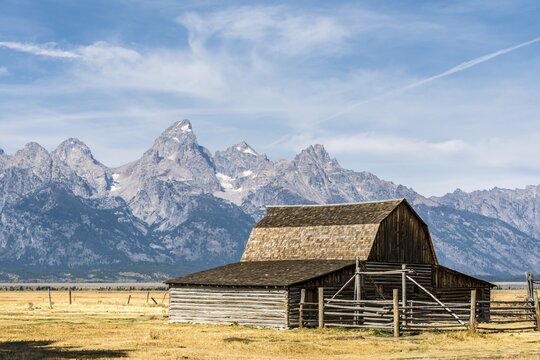 Historic old barn in front of the Teton Range, T.A. Moulton Barn, Mormon Row Historic District, Grand Teton National Park, Wyoming, USA