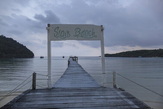 Jetty on Siam Beach in front of sunrise, Ko Kut or Koh Kood, Gulf of Thailand, Thailand