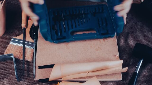 a man collects tools