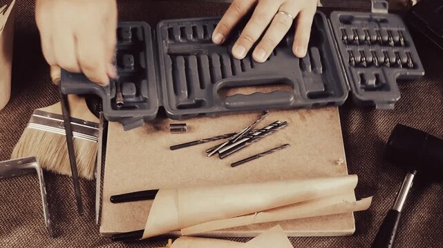 a man collects tools