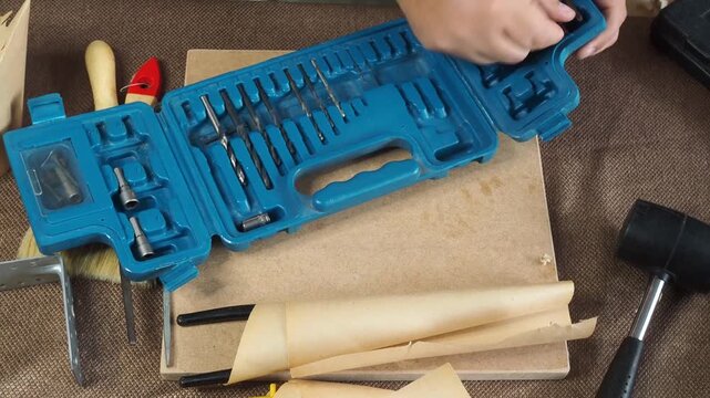 a man collects tools