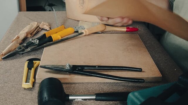 a man collects tools