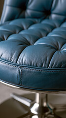 Fototapeta premium Teal blue tufted leather chair upholstery with detailed stitching creating a classic pattern, highlighting comfort and sophisticated furniture design elements and fabric texture