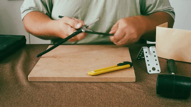 A man is doing repairs.
