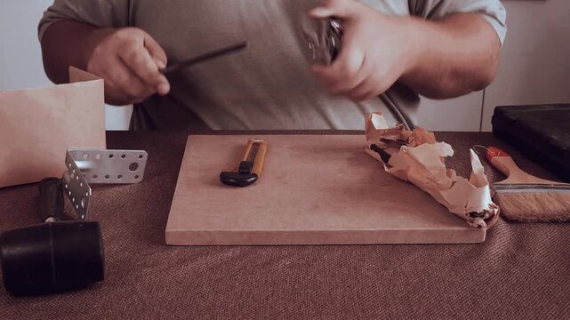 A man is doing repairs.