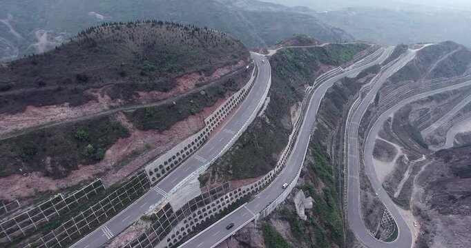 Winding Mountain Highway Through Rugged Hills