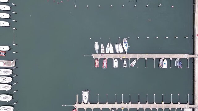Aerial geometric shot of sailing boats docked at Gdynia marina