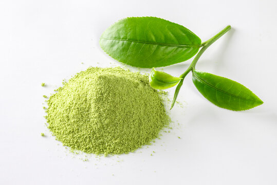 powdered matcha tea on white background