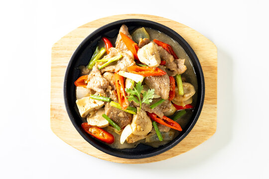 Hot oyster sauce in a pan on a white background.