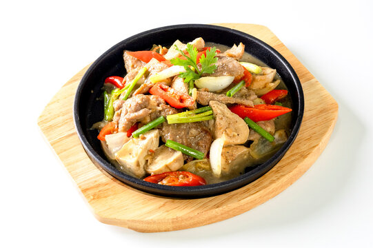 Hot oyster sauce in a pan on a white background.