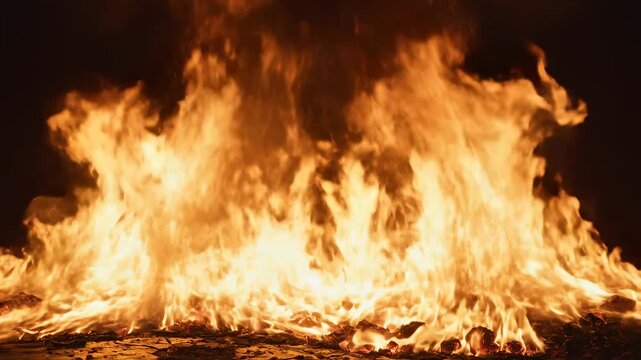 Large flames burning intensely in the dark