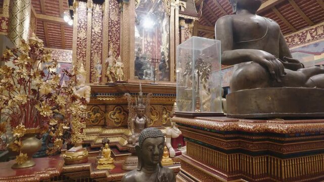 Buddha images, stupas, and replica castles; Thai Buddhist art at Wat Pa Daraphirom, Chiang Mai.