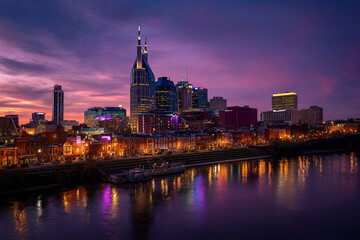 Fototapeta premium A vibrant dusk cityscape reflects in a calm river. Modern skyscrapers and historic buildings gleam under a colorful sky