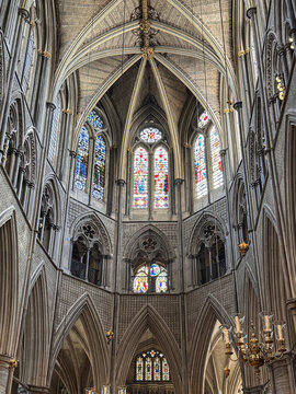 Gothic Westminster Abby Interior With Soaring Vaulted Ceiling, Arched Nave, Chandeliers and Ornate Altar Screen