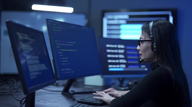 Smiling woman call center agent with headset working in a modern office