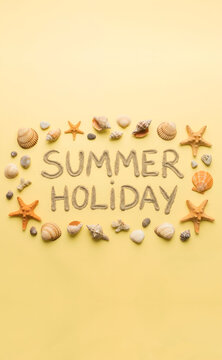 Summer holiday text written in sand with seashells and starfish on yellow background, generative AI, flat lay.