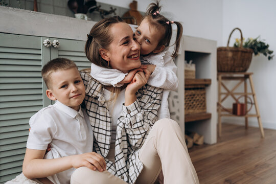 Happy mother and child enjoying family time together at home