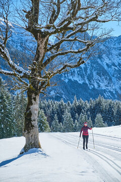 Cross-country skiing on a snowy mountain trail in Tirol
