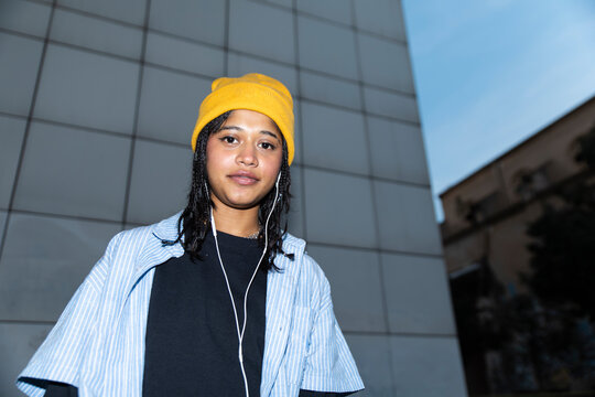 Portrait with yellow beanie and headphones in El Raval Barcelona