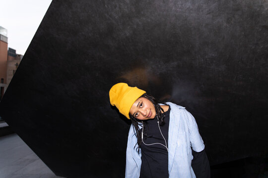Streetwear portrait with headphone at night in Barcelona