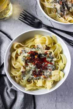 Creamy wild garlic tagliatelle with burrata and crispy chili