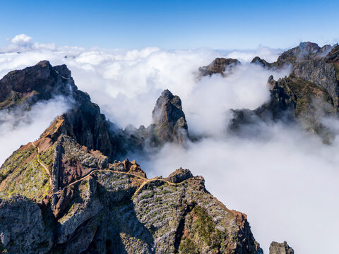 Volcanic peaks of Pico do Arieiro piercing through sea of clouds