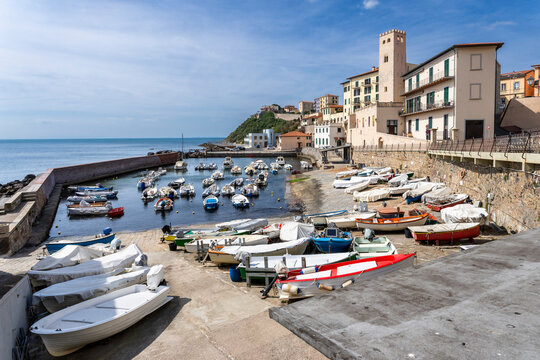Small boats in the harbor of Piombino old town in Tuscany Italy