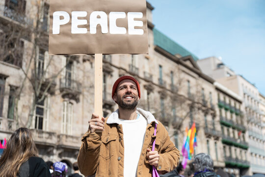 Activist holding a peace sign at a protest in Barcelona