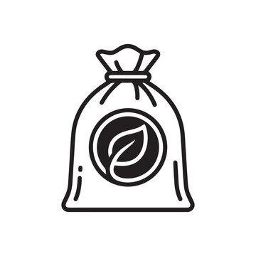 Black and white icon of a trash bag with a leaf vector silhouette 