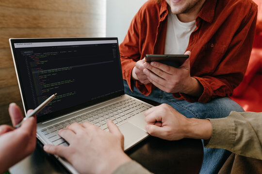 Team of programmers collaborating on software