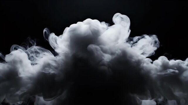 A dramatic nighttime scene features a vast, dark sky punctuated by fluffy white clouds near the bottom of the frame, creating a sense of depth and mystery.