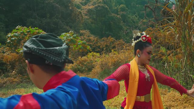 Female Traditional Dancer Performing with Male Partner in Nature