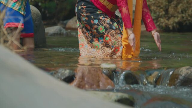 Low Angle View of Woman Splashing River Water