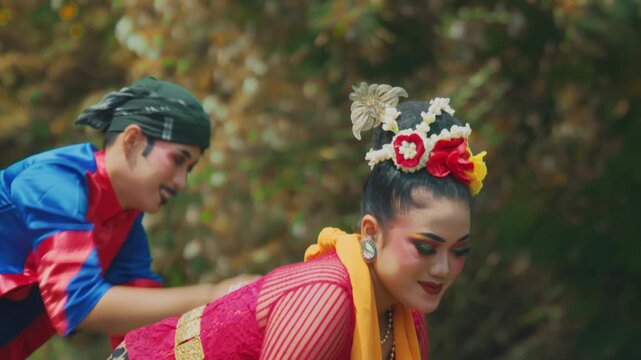 Playful Javanese Dancer Couple Splashing Water in River