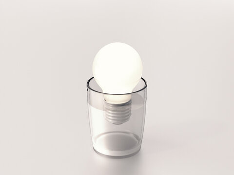 Glowing lightbulb inside a glass of water symbolizing a fresh idea