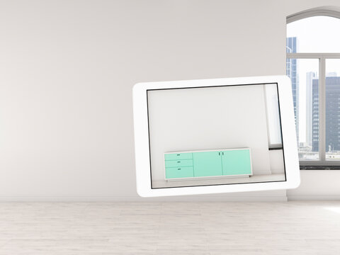 Digital tablet showing augmented reality cabinet in an empty room
