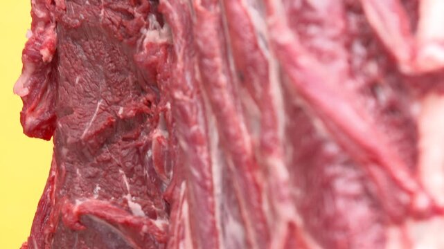 Fresh Raw Beef Hanging in Butcher Shop