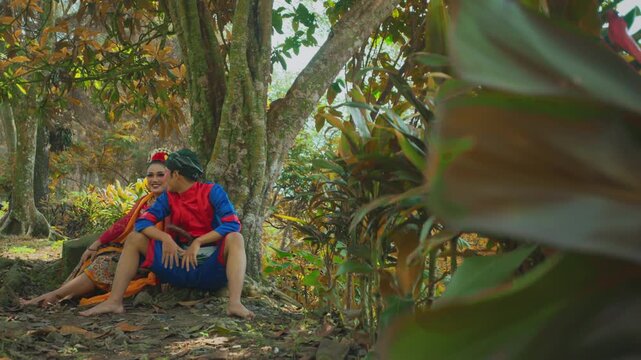Traditional Indonesian Dancers Sitting Under Tree