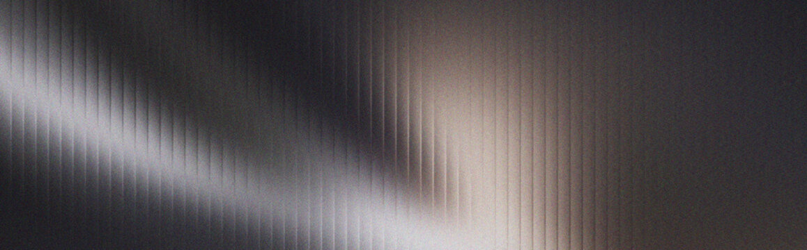 Abstract dark background with vertical stripes and soft light rays pattern.