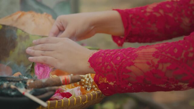 Hands Warming Over Incense and Offerings with Cigar