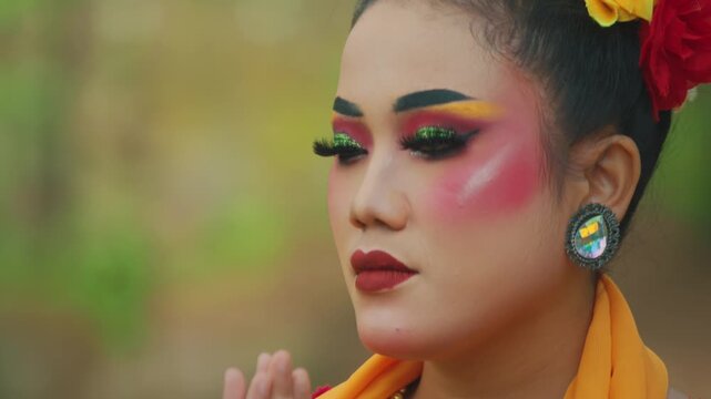 Javanese Woman Transitioning from Gaze to Prayer Gesture