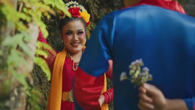 Man Hiding Flower Surprise for Woman in Forest