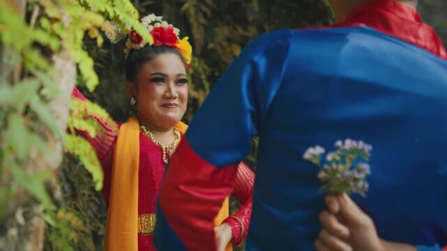 Man Hiding Flower Bouquet Behind Back to Surprise Woman