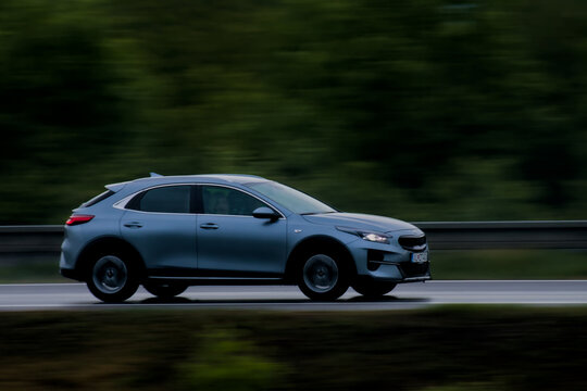 Grey Sleek Crossover Vehicle Driving on Wet Highway in Ilava, Slovakia on may 15th 2026.